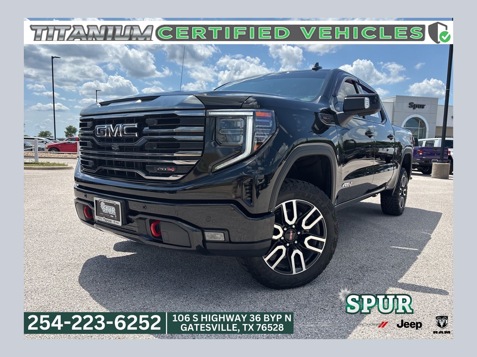 2024 GMC Sierra 1500 4WD Crew Cab Short Box AT4 in Onyx Black — front three-quarter view