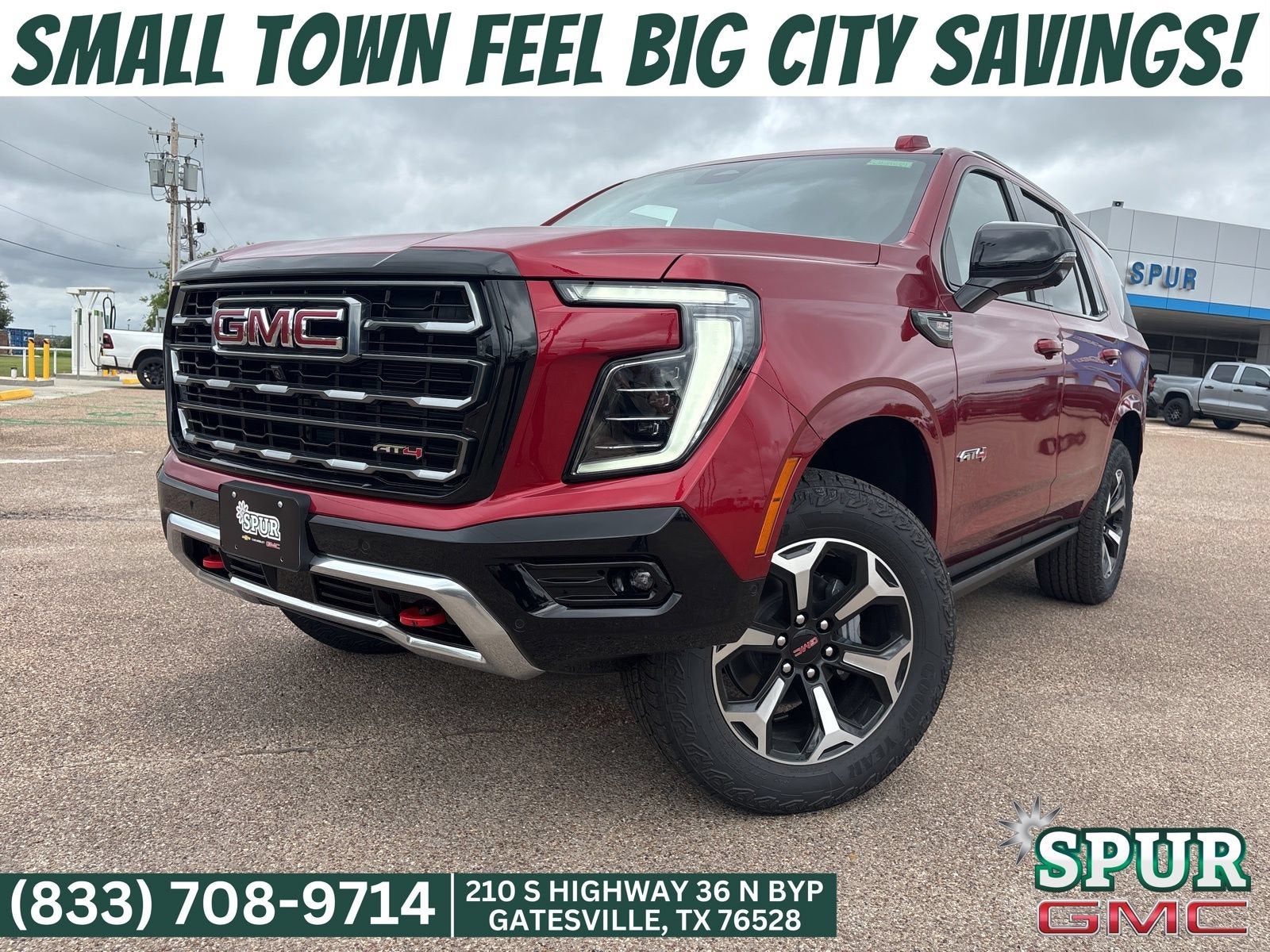 2026 GMC Yukon AT4 in Volcanic Red Tintcoat — front three-quarter view